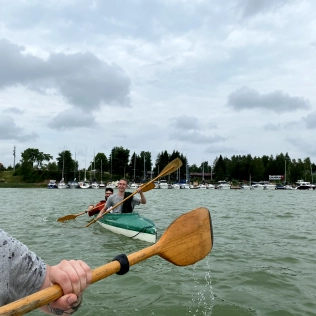 The team on canoes during a team-building trip